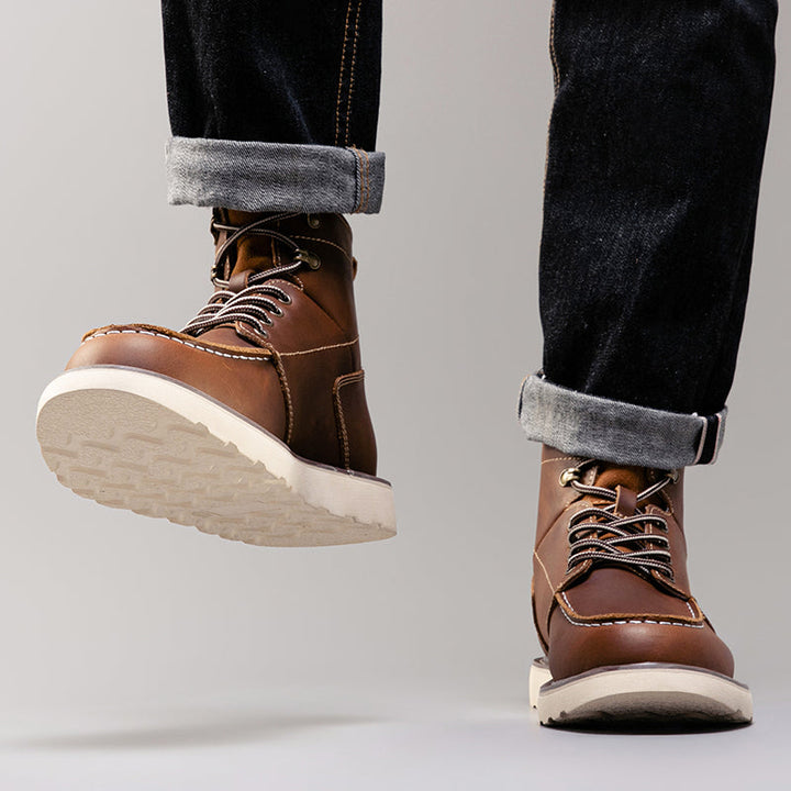 Rough texture of brown men's waterproof chukka boots, emphasizing their durable outdoor capability