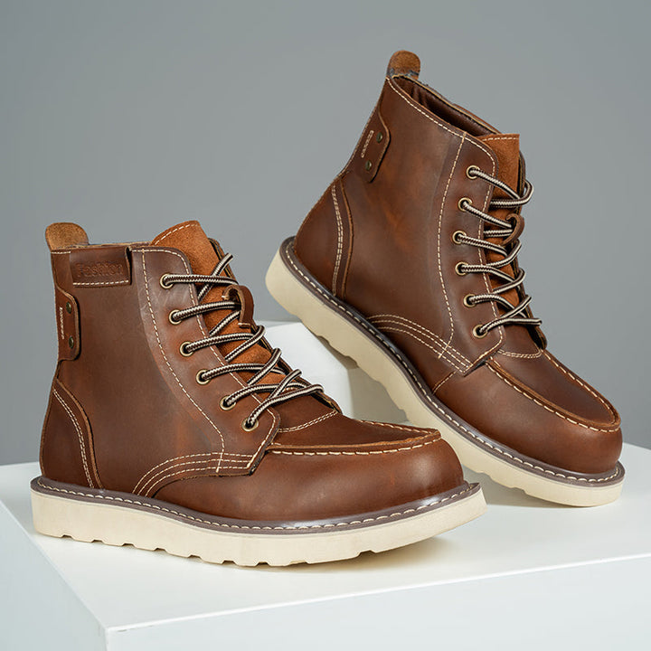 Pair of brown rugged men's chukka boots, waterproof and casual, ready for outdoor adventures