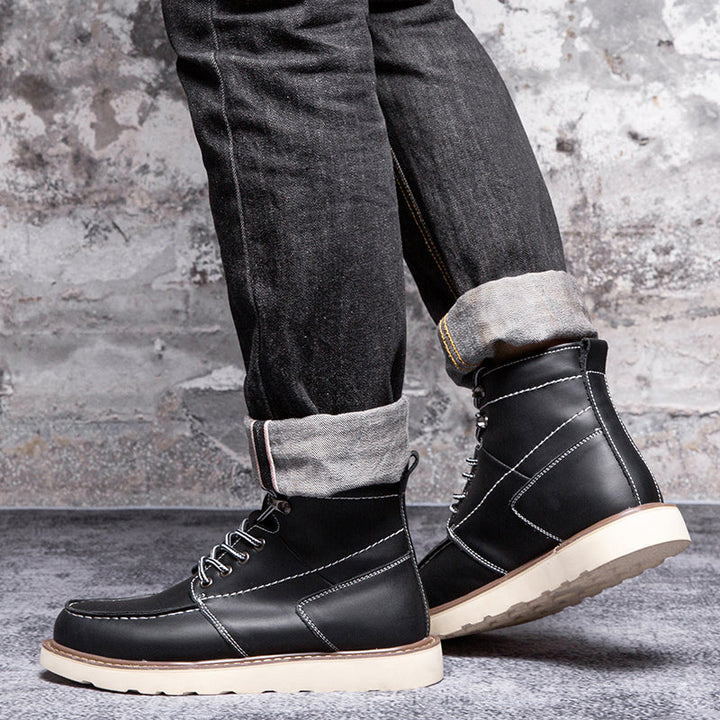 Waterproof black chukka boots for men, isolated to highlight their robust and functional features