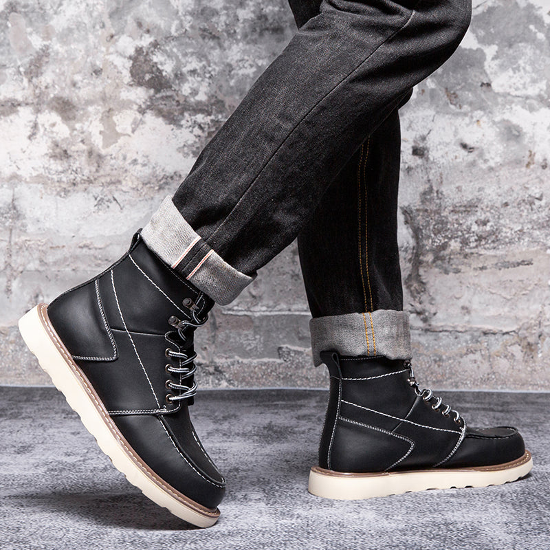 A pair of rugged brown men's chukka boots, waterproof and casual, on a rainy city street