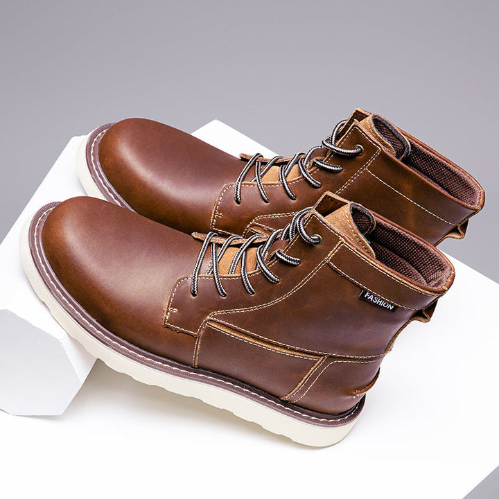 Black men's waterproof chukka boots, styled with dark denim for a fashionable, durable casual look