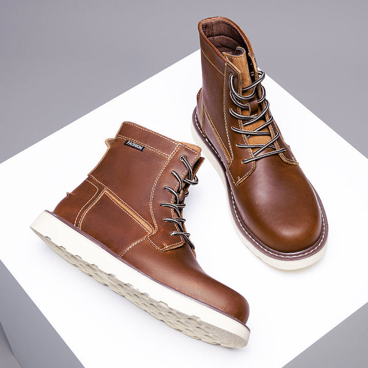 Men's brown waterproof chukka boots, resting on an ornate carpet for a contrast in casual styles