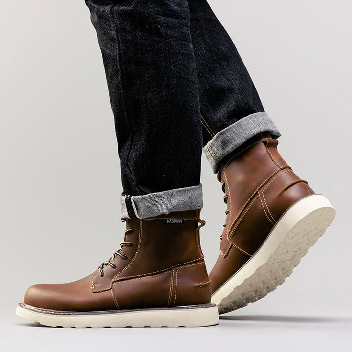 Men's brown waterproof chukka boots, pictured walking through fallen leaves, highlighting autumn wear