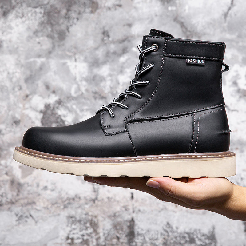 Black waterproof chukka boots for men, shown with their packaging to emphasize new product arrival