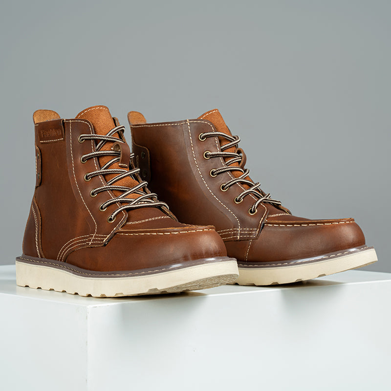 Men's feet wearing brown waterproof chukka boots, showcasing their casual and rugged style
