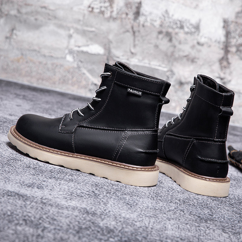 Black men's waterproof chukka boots with a detailed view of the sole's strong grip for durability