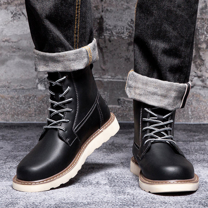 Black men's waterproof chukka boots, captured in a dynamic pose to reflect their active and durable nature