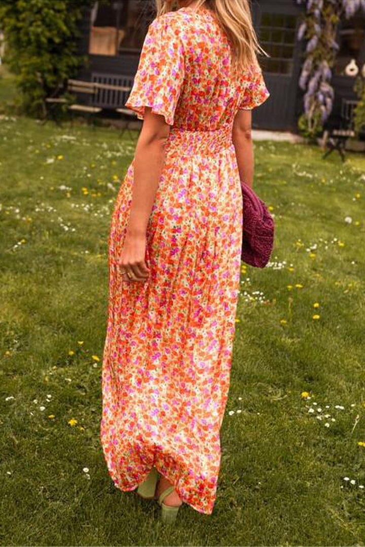 Colorful V-neck floral maxi dress, ideal for summer weddings & elegant parties.