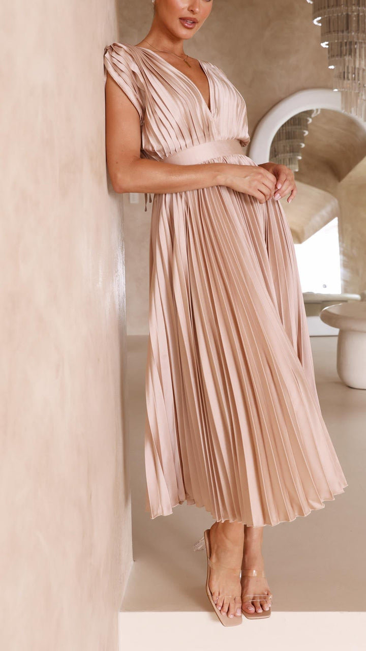Silk pleated maxi dress with V-neck in rose red, featuring a high waist and elegant flowing pleats for a sophisticated look.