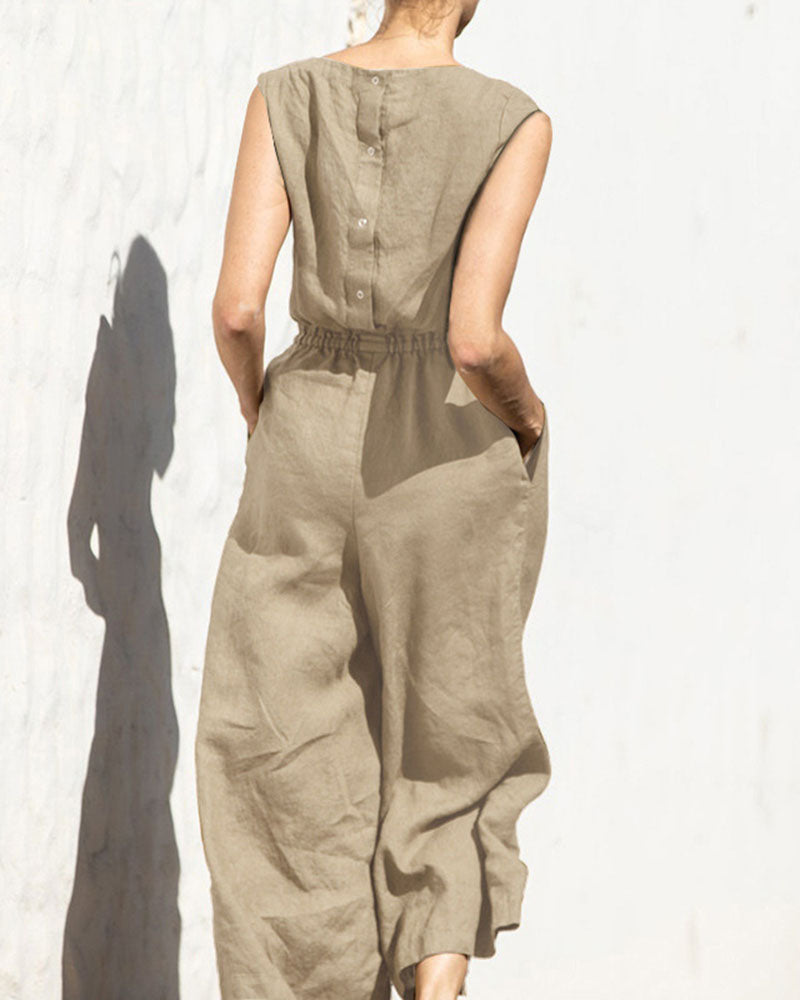 Woman modeling a sleeveless wide leg jumpsuit, showcasing comfortable and chic summer fashion apparel.