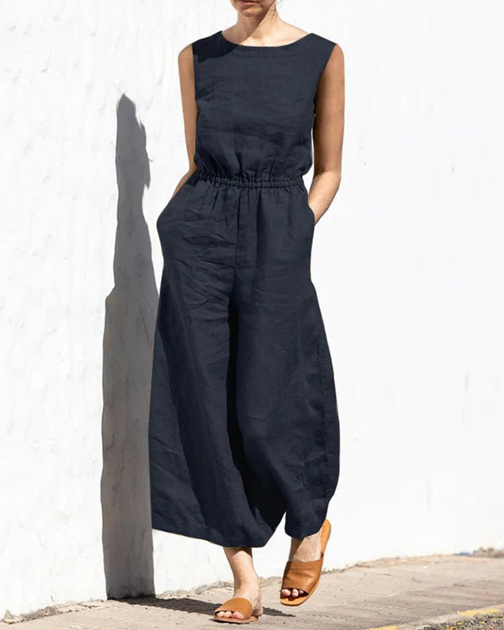 Flowy women's sleeveless wide leg jumpsuit, offering comfortable and elegant summer apparel. Chic style.
