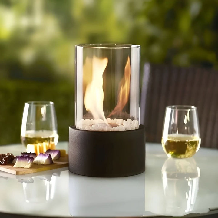 Elegant black tabletop bioethanol fireplace, providing smokeless, cozy lighting for any space.