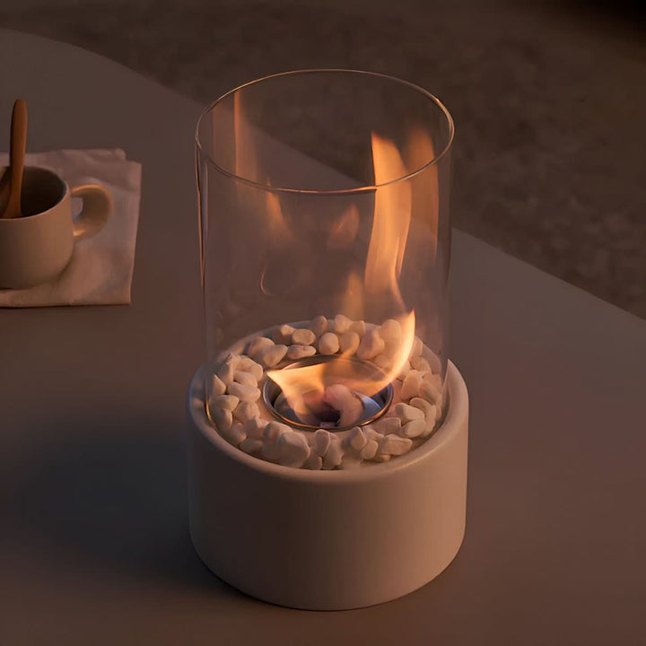 White modern tabletop fireplace with a smokeless bioethanol flame, perfect for cozy indoor & outdoor decor.