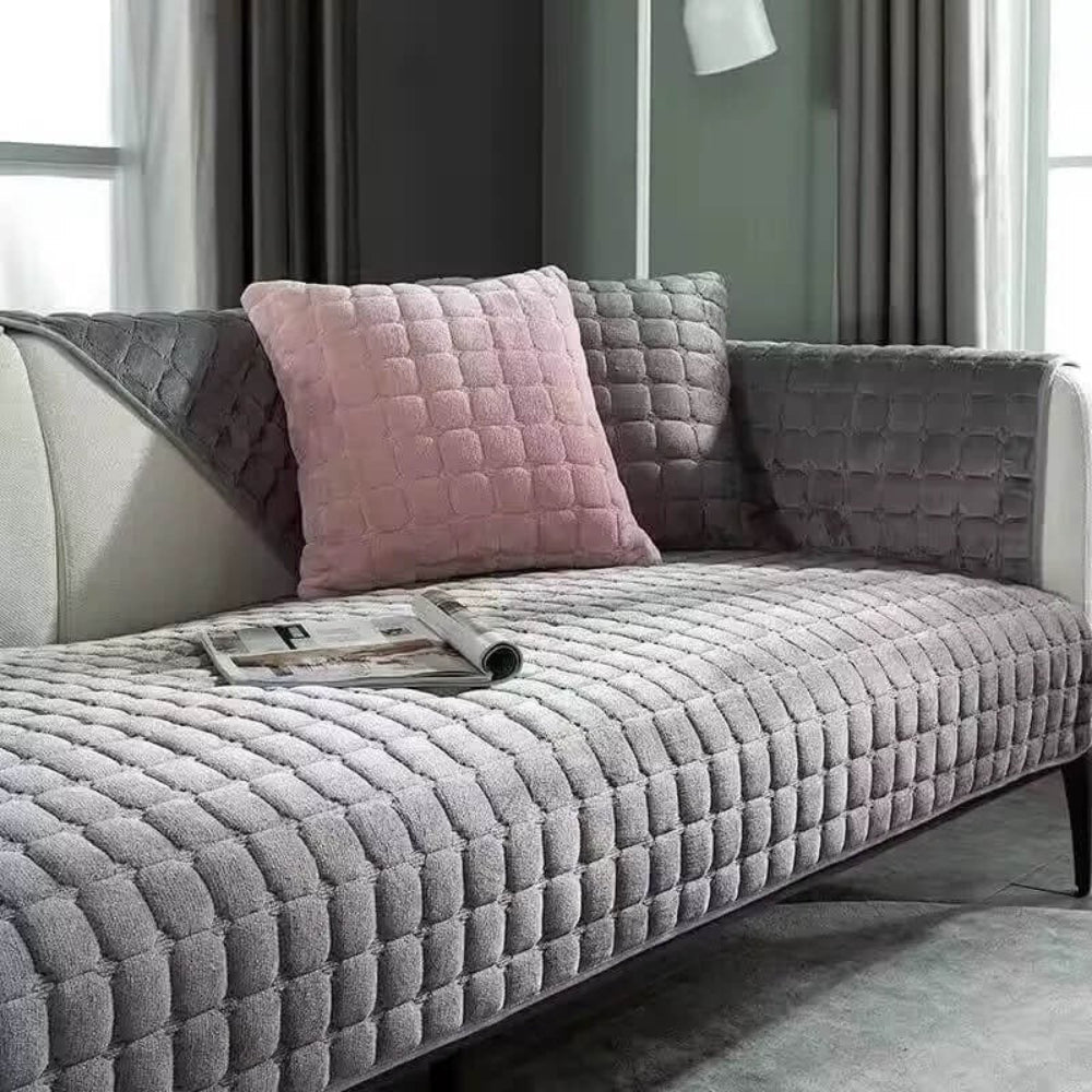 Flannel sofa cover in a living room, showcasing its anti-slip design that keeps it securely in place.