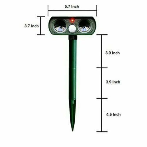 Effective solar-powered animal deterrent setup in a yard. Motion-activated ultrasonic device for humane pest prevention.