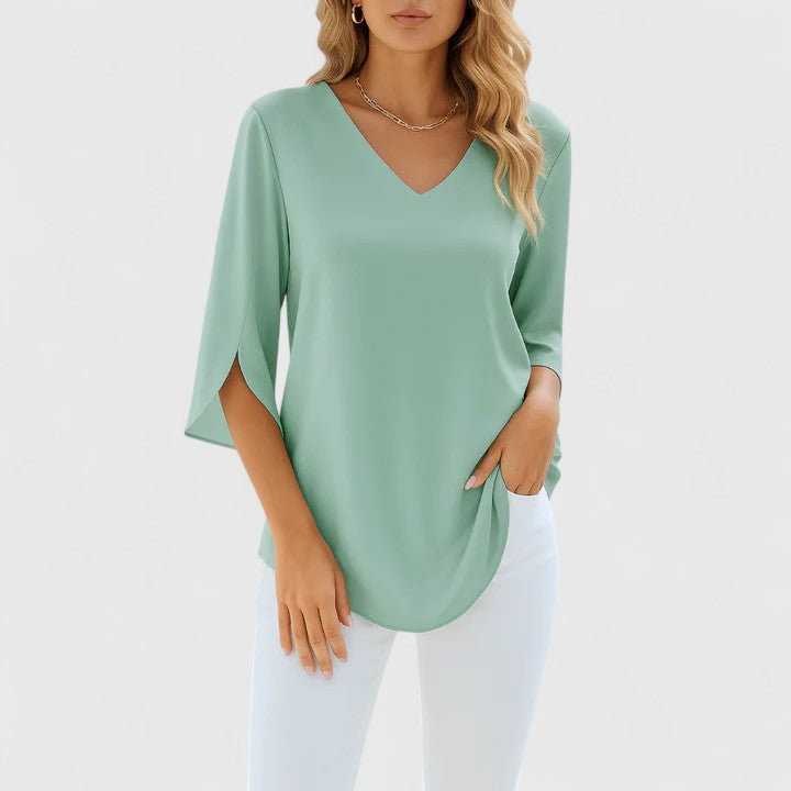 Modern women's V-neck top, a chic and versatile blouse. Ideal for sophisticated casual wear & effortless summer style.