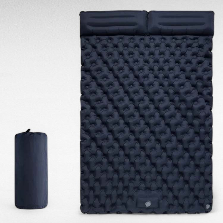 Portable green double air mattress, inflatable 2-person sleep pad, essential for camping comfort.
