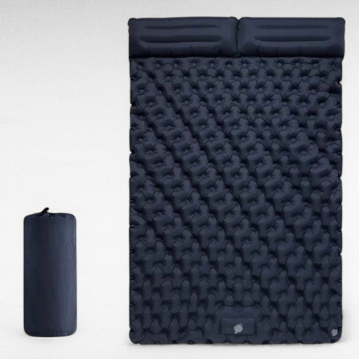 Portable green double air mattress, inflatable 2-person sleep pad, essential for camping comfort.
