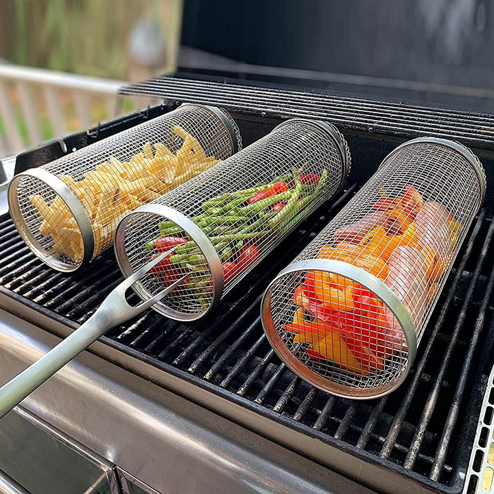 "Stainless steel BBQ grill basket with rotating design for even grilling of veggies and meats, enhancing cooking flavors."