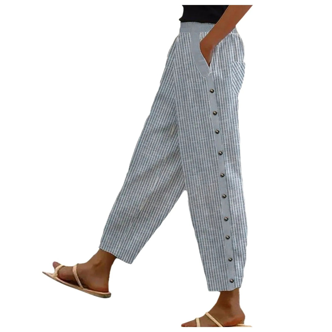 Chic high-waist striped women's trousers with elegant decorative buttons, ideal for office or casual wear.