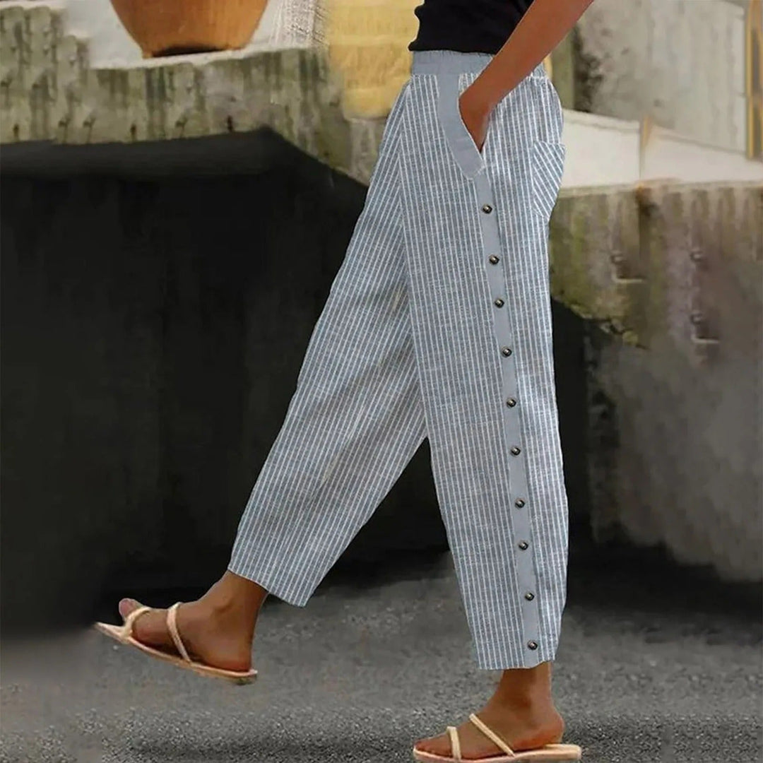 Elegant striped high-waist women's pants with stylish decorative buttons, a versatile fashion bottom.