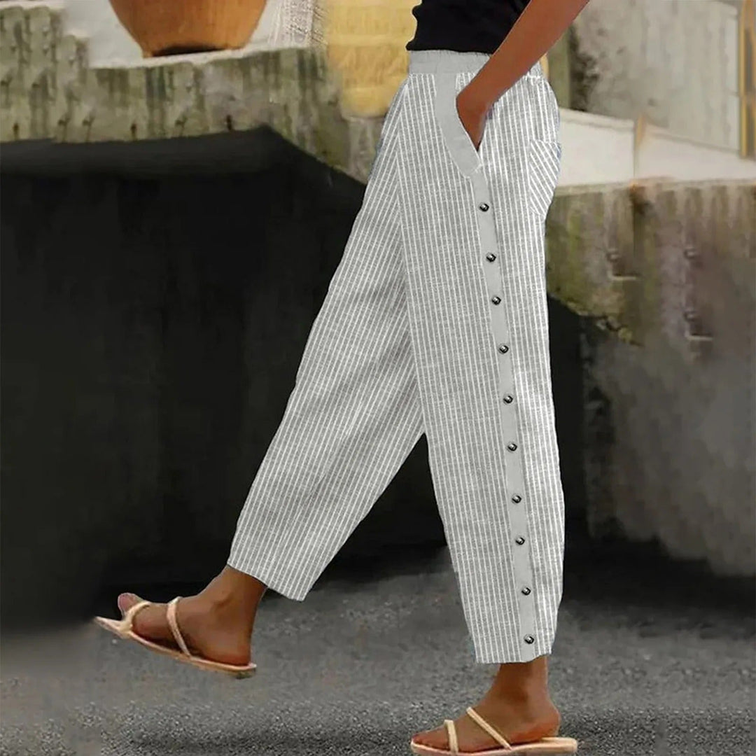 Comfortable & flattering high-waist striped trousers for women, featuring chic decorative buttons.