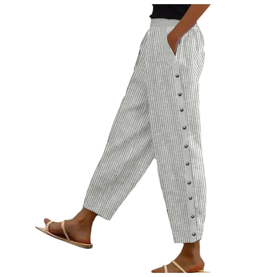 Women's striped high-waist trousers with decorative buttons, offering a chic & versatile fashion statement.