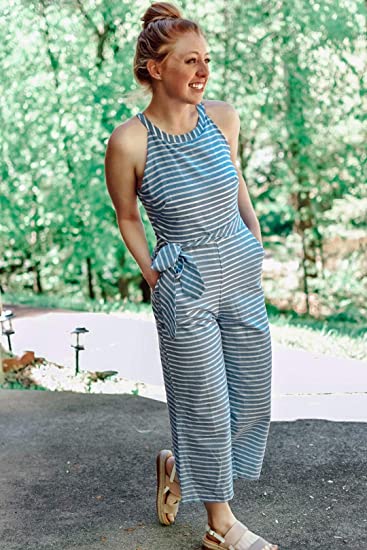 Modern striped women's jumpsuit with a wrap neck and wide legs, a key piece for summer fashion trends.