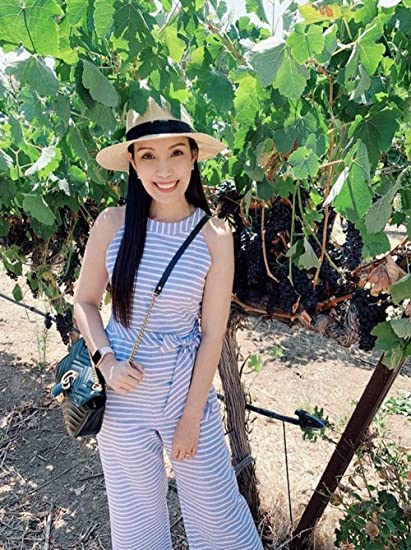 Chic women's sleeveless striped jumpsuit with a wrap neck and wide legs, versatile for summer style.
