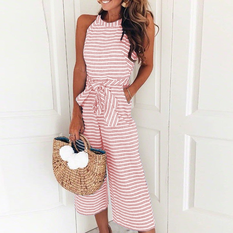 Casual yet elegant women's striped jumpsuit with a wrap neck and wide legs, great for summer fashion.