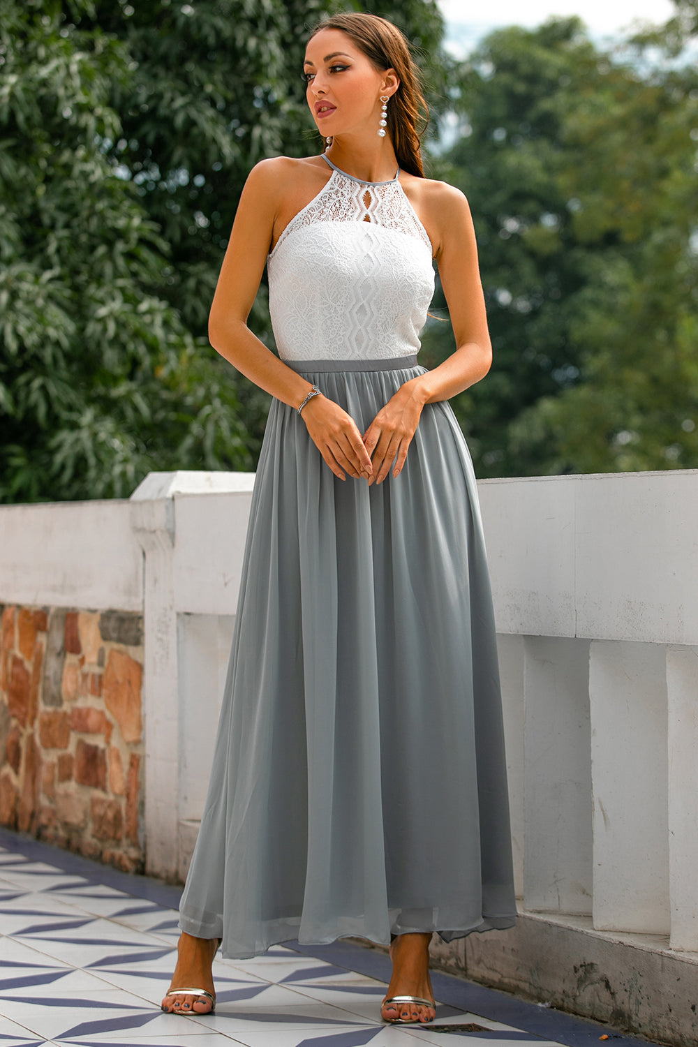 Stunning women's halter wedding guest maxi dress. Elegant floor-length formal gown for a chic special occasion look.