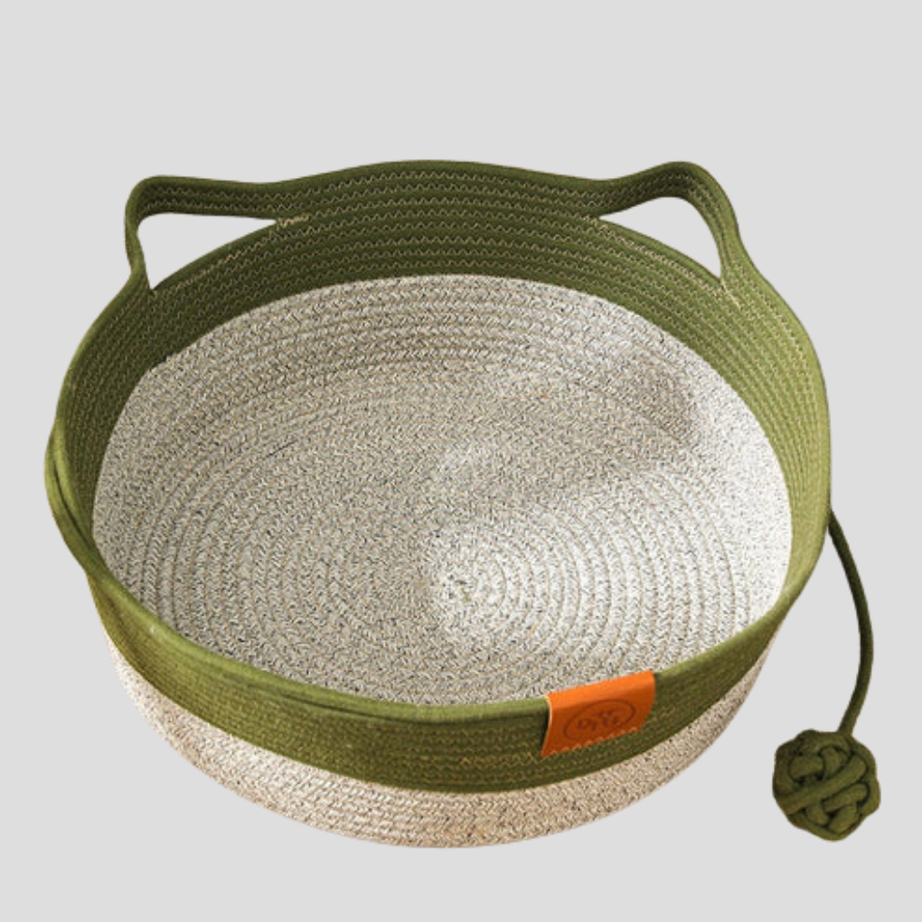 Cozy green cotton rope cat bed. Modern woven pet lounge for indoor cats to relax.