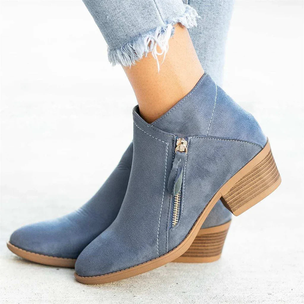 New blue women's ankle boots featuring a chic zip heel, offering both style and comfortable footwear.
