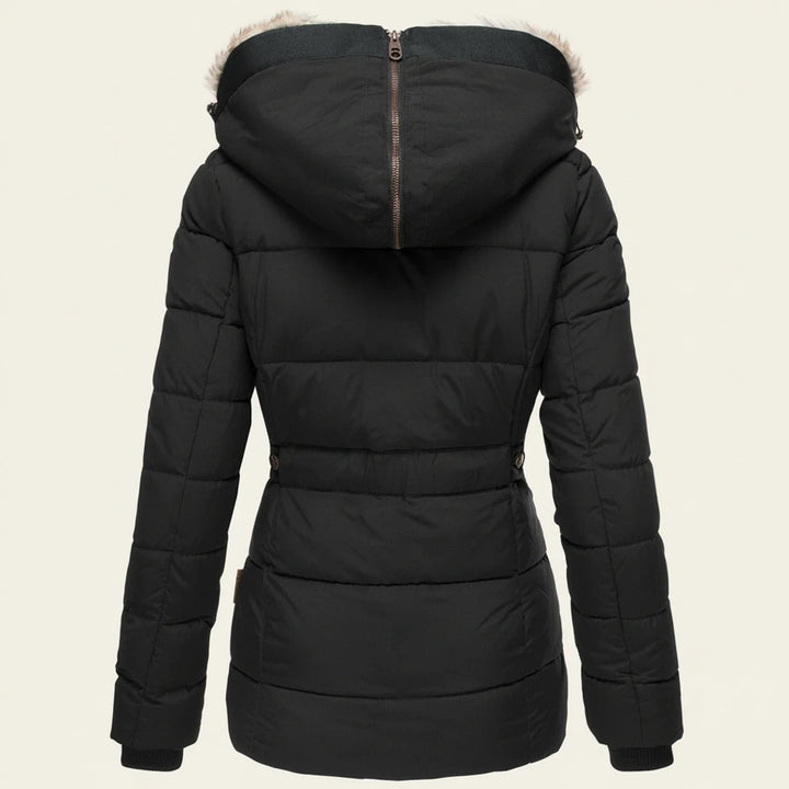 Women's hooded winter puffer jacket with faux fur trim, designed for cold weather style & warmth.