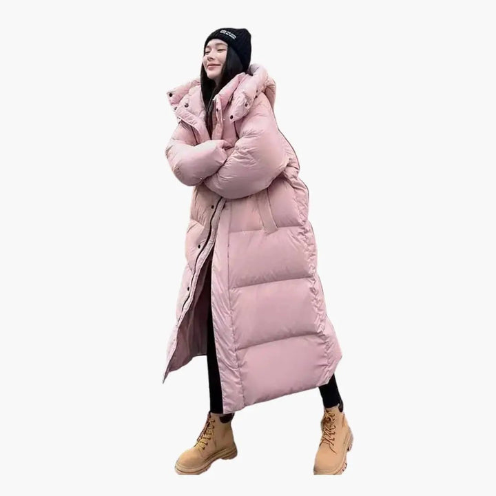 Stylish women's long puffer jacket with a cozy hood, perfect for staying warm in cold winter weather and fall fashion.