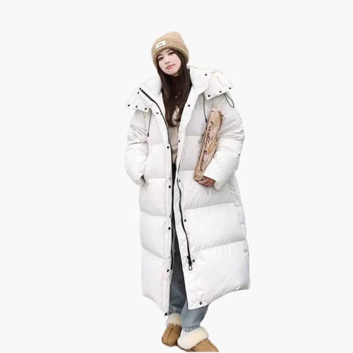 Cozy women's hooded long puffer jacket for ultimate comfort and warmth. Stylish outerwear for cold weather.