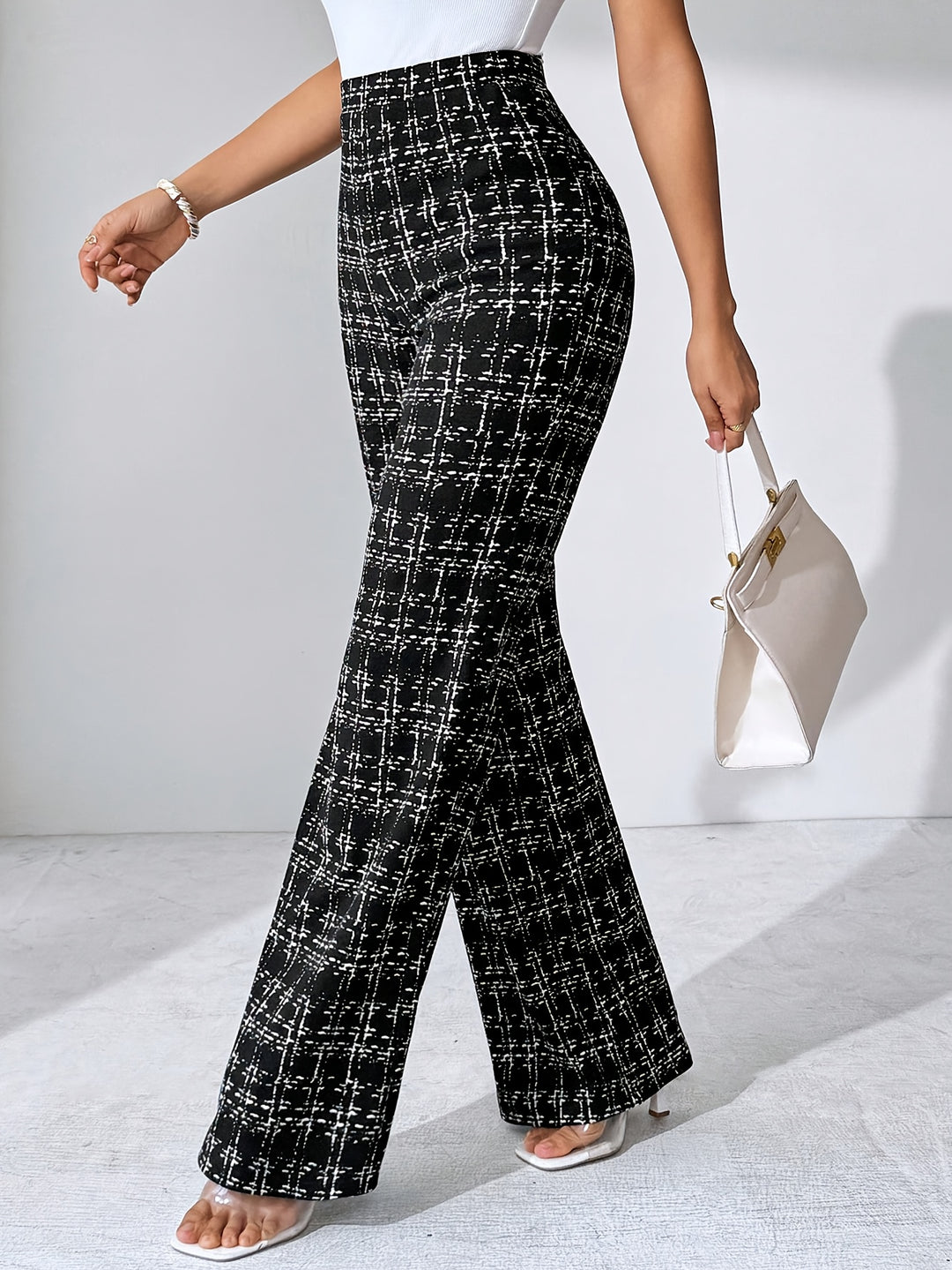 Stylish women's plaid flared knit pants, high-waisted comfort, casual chic.