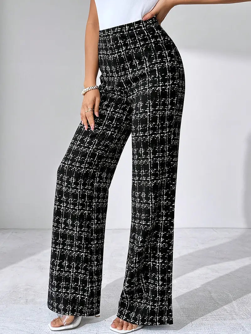 Close-up of the plaid pattern on women's flared knit trousers, high-waisted detail.
