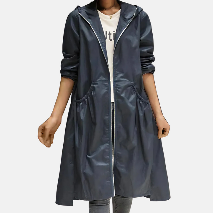 Front view of a women's water-resistant hooded rain jacket, knee-length, ensuring protection & style for everyday wear.