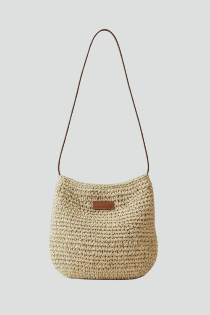 Stylish women's woven shoulder bag with a long strap, perfect for everyday use or crossbody wear.