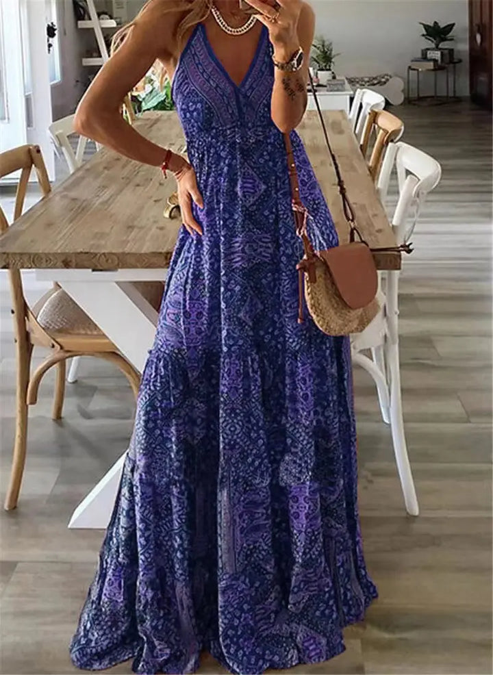 Women's floral boho maxi dress for summer. Elegant sleeveless long dress with a flowy design, perfect for beach or party.