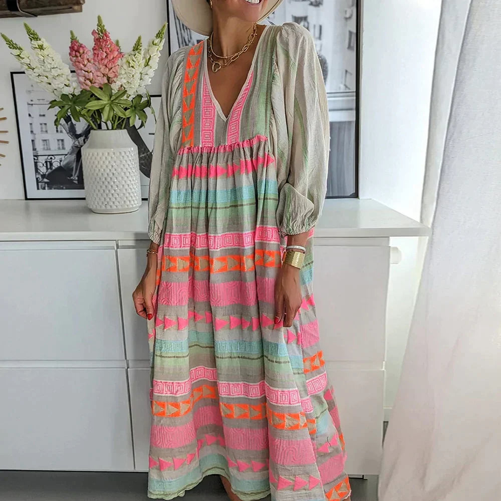 Flowy women's gradient maxi dress for summer. Vibrant colors, long sleeves, casual yet elegant vacation wear.