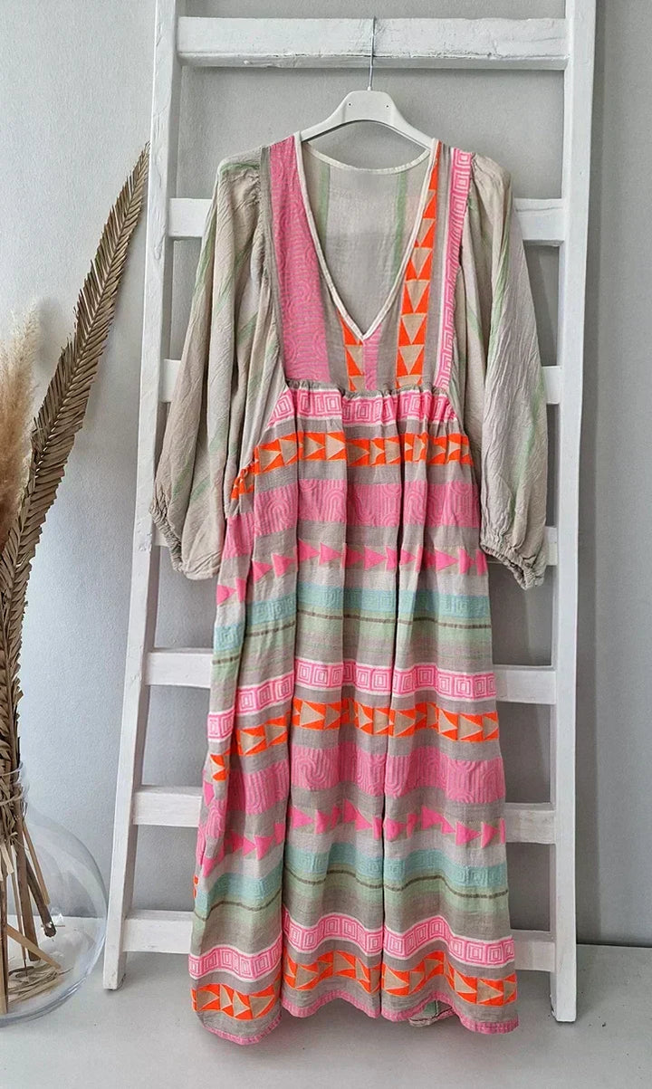 Vibrant gradient summer maxi dress for women. Colorful, flowy, and elegant, ideal for effortless vacation style.