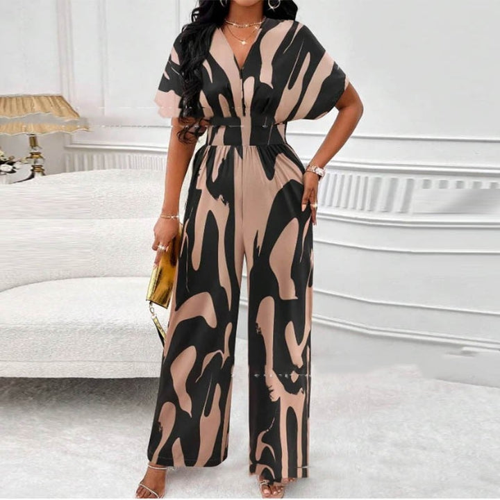 Chic women's printed V-neck jumpsuit, perfect for summer fashion and vacation wear. Comfortable relaxed fit.