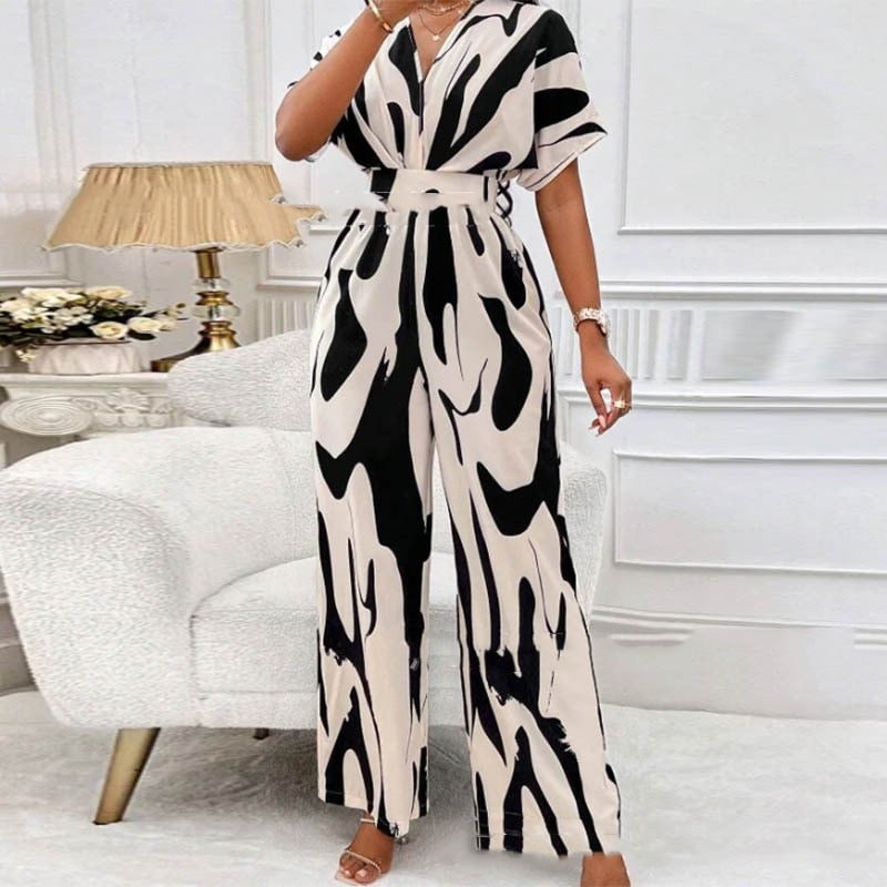 Effortless women's summer printed V-neck playsuit with short sleeves. Comfortable & chic for warm weather.