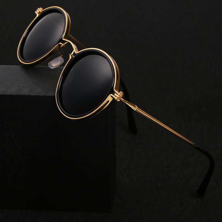 Stylish unisex polarized round sunglasses with gold temples, offering UV protection & glare reduction.