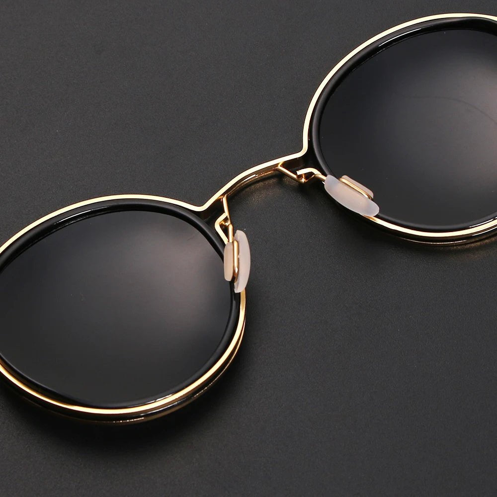 Fashion accessory: Unisex polarized round sunglasses with gold metal temples, offering stylish UV protection.
