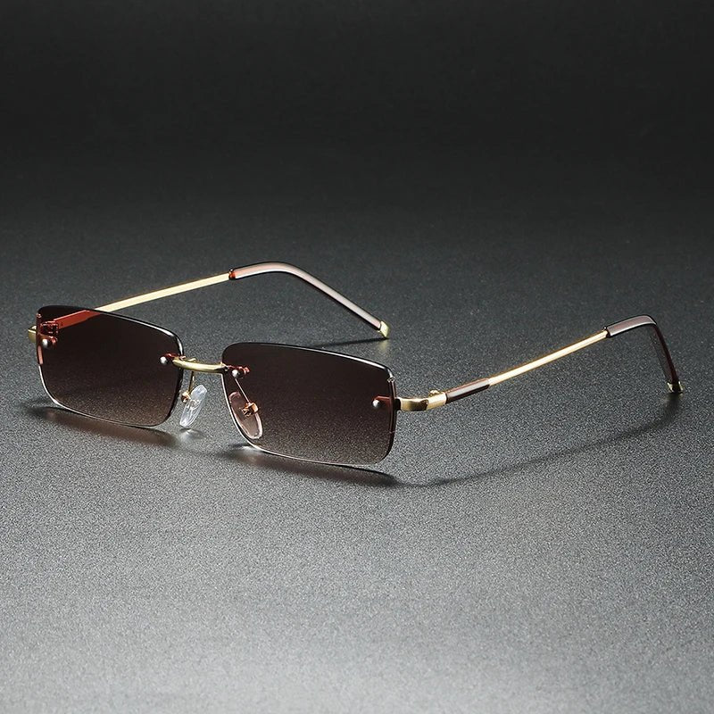 Protect your eyes with these unisex gold rimless rectangular gradient sunglasses. Lightweight & stylish modern eyewear.