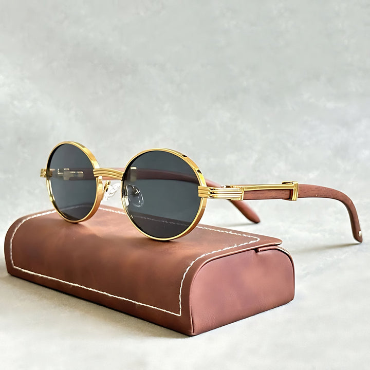 Unisex round gold frame sunglasses offering stylish UV400 protection.