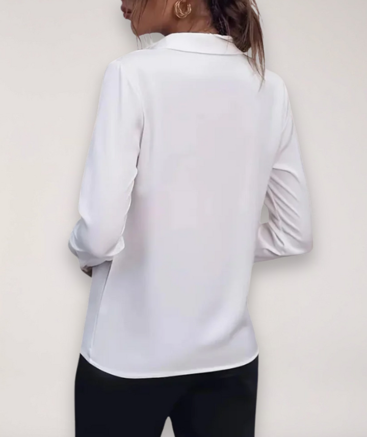 Chic women's button-up blouse, versatile for daily wear. Classic long sleeve top for casual & smart looks.